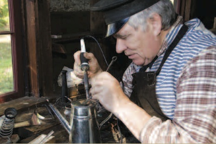Silversmith engaged in his craft